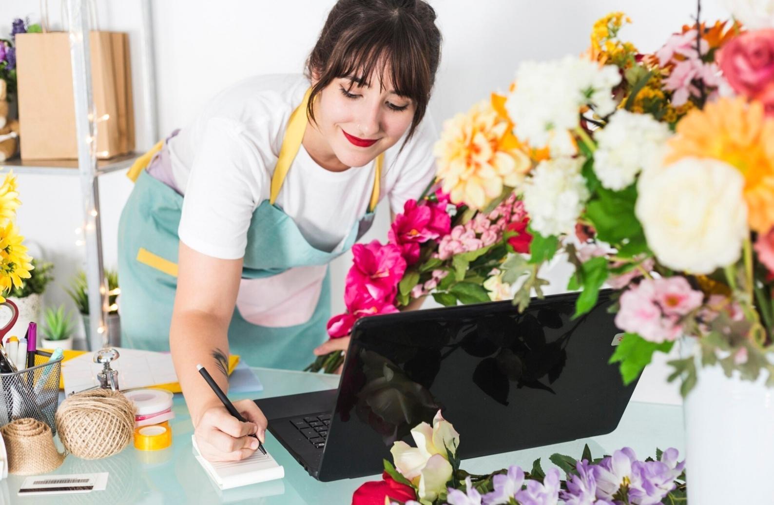 Kindtech Prismo studio workspace showcasing floral arrangement materials and design area in Baku