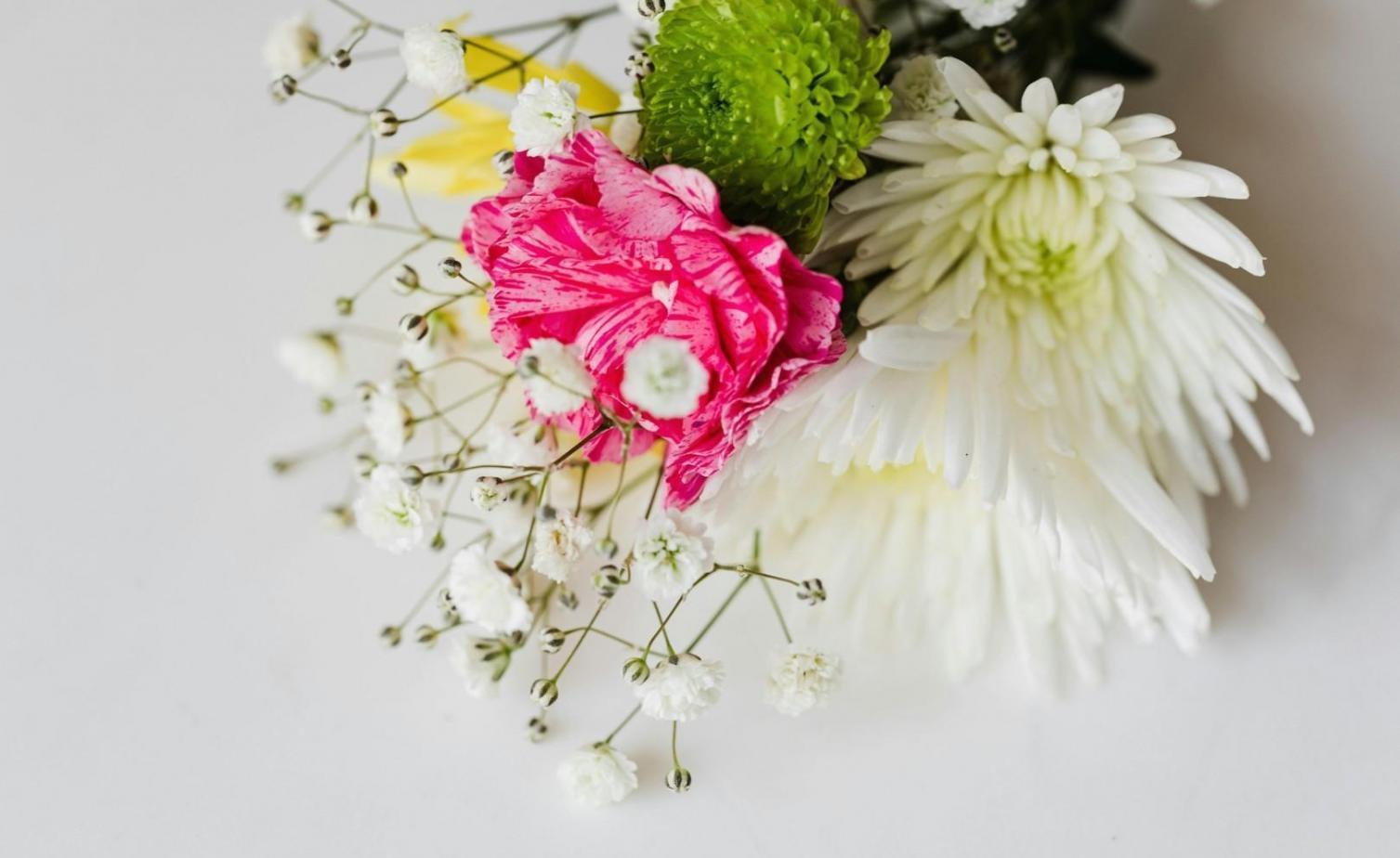 Floral arrangement preparation for corporate event in modern Baku office space